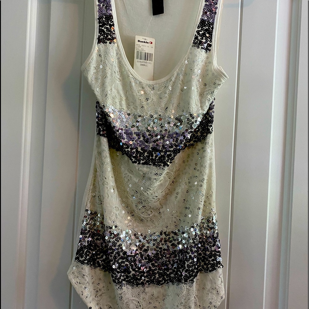 Buckle tank top with sparle embellishments on front.